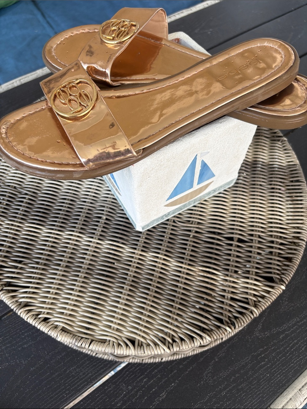 BEBE Metallic Rose Gold Slide Mules with Gold Emblem
